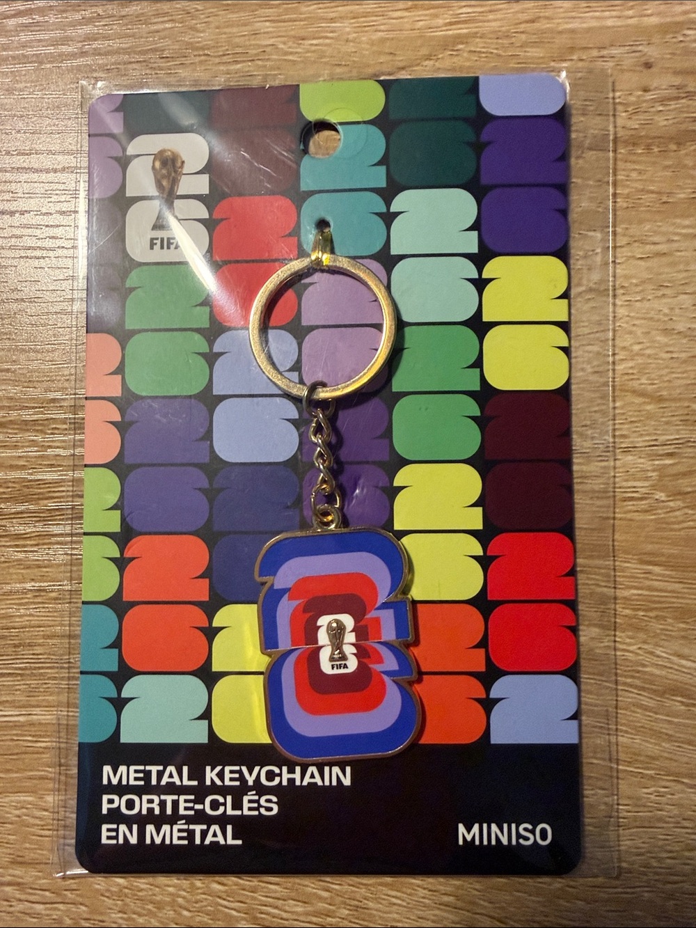 MINISO FIFA Multicolor Metal Keychain — Blue, Red & Purple Accent